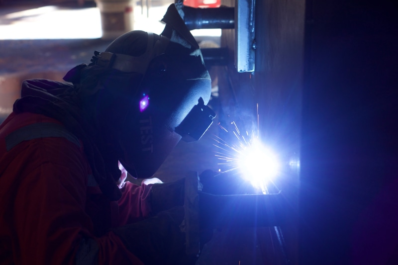 job, gas, indoors, alloy, engineer, lens flare, sparks, person, construction, manufacture, fabrication, protective glove, metal, men, engineering, spark