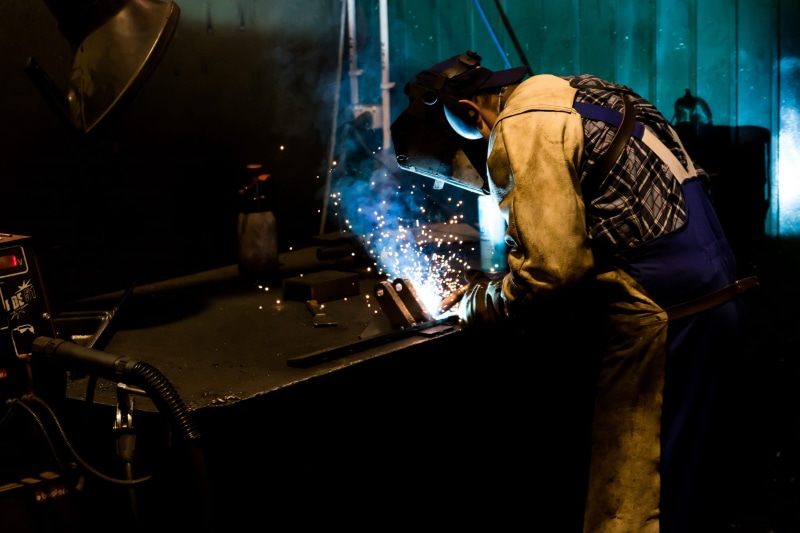 industry, machining, black, workshop, company, men, protective mask - workwear, motion, real people, metal, the device, machine, factory, metal working