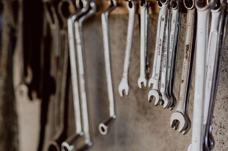 architecture, history, wrench, open, garage, screwdriver, hanging, built structure, musical instrument, the past, mechanic, close-up, toolbox, large group of objects