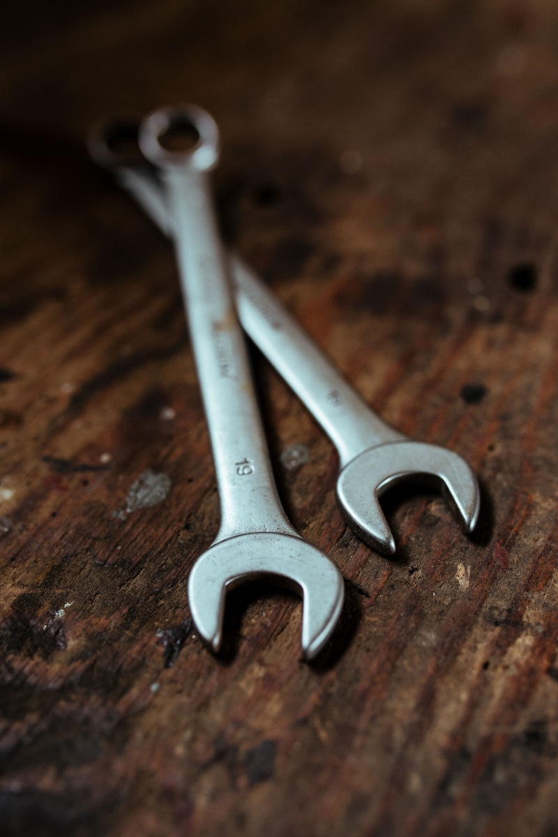 selective focus, nails, silver colored, close-up, hand tool, wrench, diy, screw, brown, equipment, workshop, 5K, indoors, repairing, tool, nuts, shed