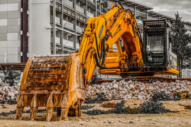 outdoors, day, digger, factory, construction site, industrial equipment, mode of transportation, excavator, earth mover, heavy machine, machinery, hydraulic