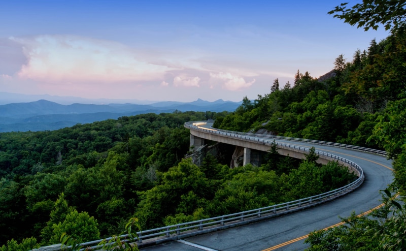 bridge, scenics - nature, mountain, nature, outdoors, built structure, hill, river, growth, green Color, blue, mountains, street, sky, forest, landscape