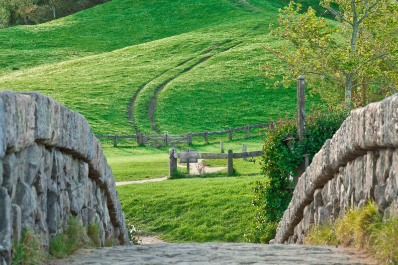 outdoors, field, architecture, ancient, wall, archaeology, grass, fence, Hobbiton, hills, green, trees, tranquil scene, built structure, old ruin, landscape