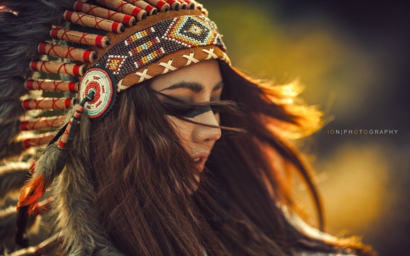 lifestyles, headdress, brunette, indian hat, red, young adult, face paint, hair, glasses, women, headshot, leisure activity, clothing, looking, fashion