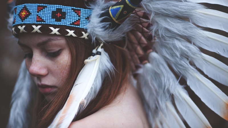 native, one person, headshot, hat, freckles, costume, 1080P, focus on foreground, crown, celebration, emotion, looking away, redhead, women, adult, face