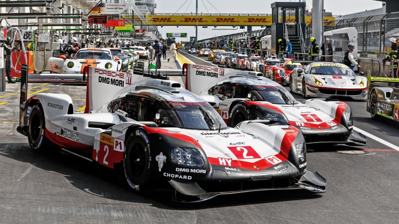 race, incidental people, travel, transportation, text, road, porsche, championship, motor vehicle, car, built structure, 2K, land vehicle, street, wec