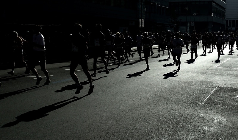 shadow play, athlete, group of people, transportation, large group of people, leisure activity, sunlight, hobby, run, day, people, personal, human, men
