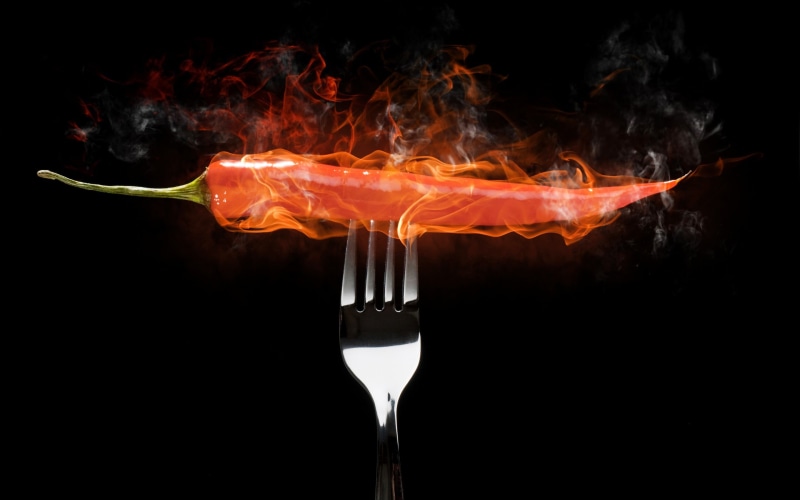 black background, smoke - physical structure, italian food, kitchen utensil, household equipment, fire, food and drink, pasta, drink, eating utensil, alcohol