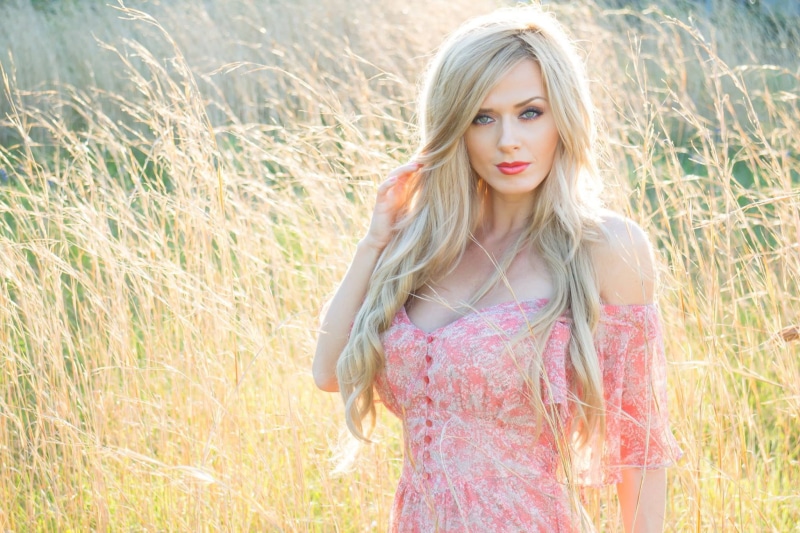 portrait, hair, face, white, one person, contemplation, front view, looking at camera, land, blond hair, women, plant, blonde, adult, beautiful woman, grass