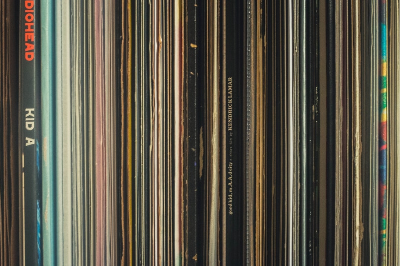 vinyl, text, full frame, indoors, multi colored, abundance, kid a, education, shelf, backgrounds, side by side, records, arrangement, publication, order
