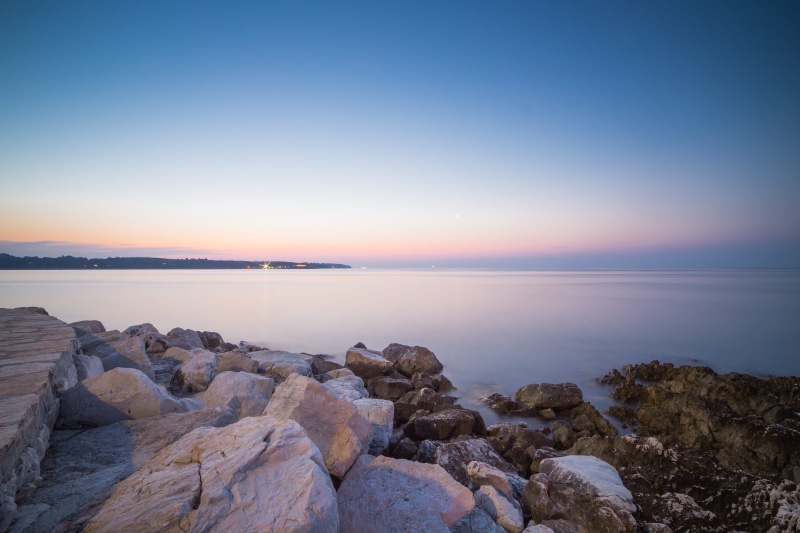 rock - Object, blue, nature, land, water, landscape, coastline, sunlight, horizon, ocean, beautiful, scenics - nature, beach, solid, sunrise - Dawn, rock