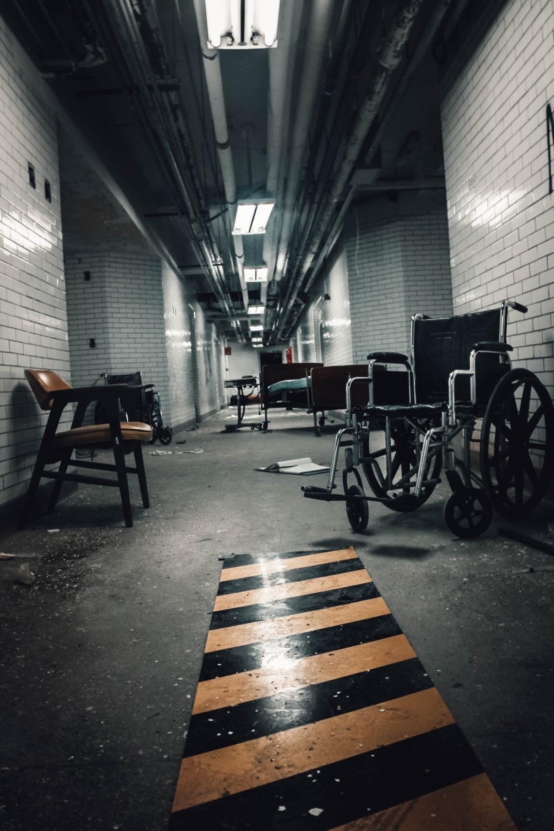 mode of transportation, city, building, horror, architecture, illuminated, empty, architectural column, eerie, mental hospital, parking lot, indoors, built structure