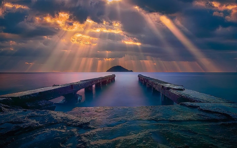 clouds, cloud - sky, reflection, scenics - nature, tranquility, coast, beauty in nature, yellow, sun rays, idyllic, landscape, dock, island, horizon over water