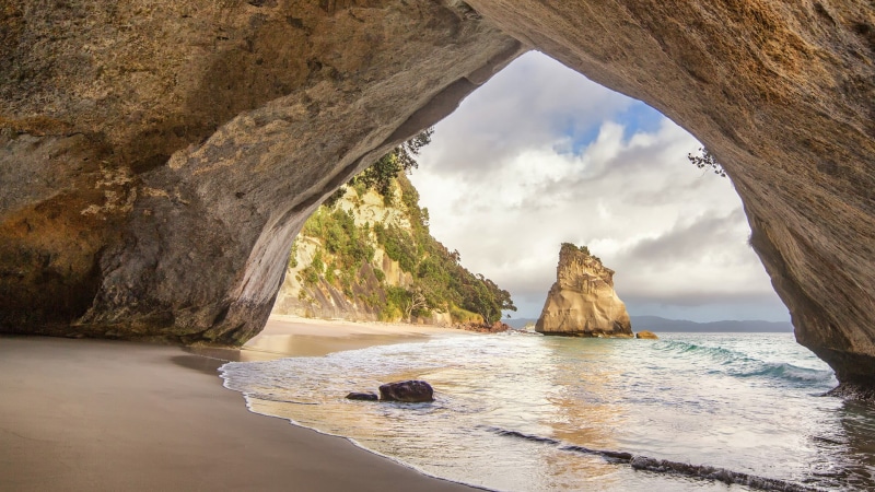 natural arch, eroded, scenics - nature, 1080P, beach, day, cloud - sky, stack rock, ocean, nature, rock, horizon over water, non-urban scene, New Zealand