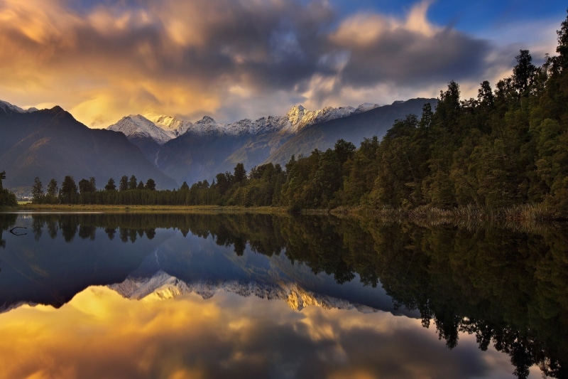 beauty in nature, mountain, pine tree, pine woodland, mountain peak, sky, environment, reflection, scenics - nature, landscape, sunset, mountain range