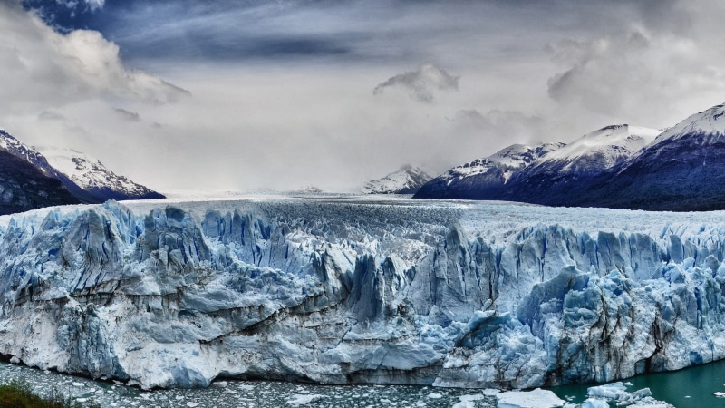 melting, snow, cloud - sky, snowcapped mountain, frozen, sky, beauty in nature, sea, environment, outdoors, cold temperature, glacier, glaciers, ice, water