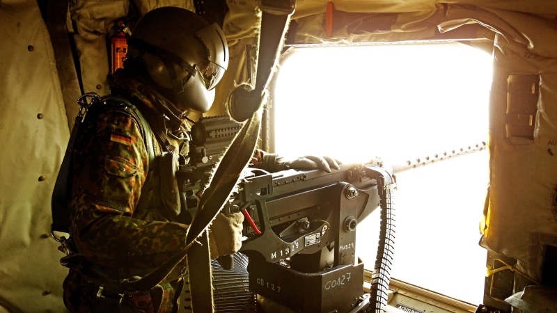 three quarter length, aerospace industry, day, air vehicle, black, vehicle interior, military, control, gray, nature, indoors, uniform, helicopters, 2K