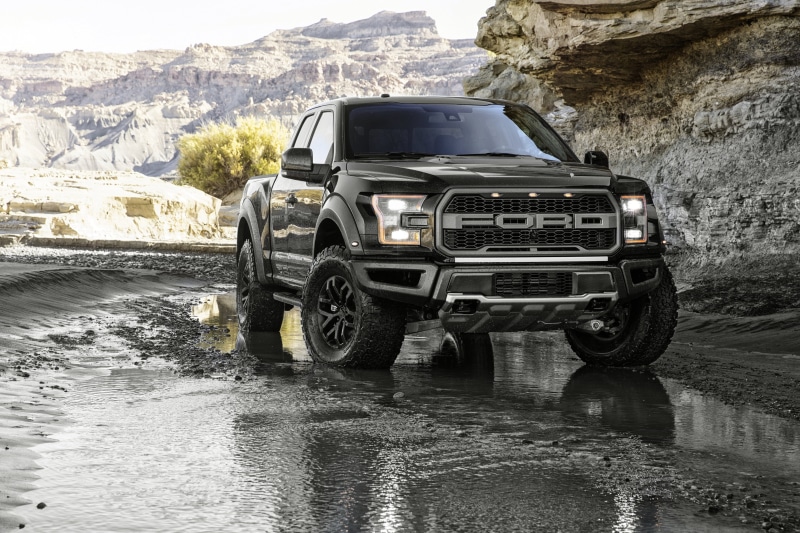 truck, stationary, reflection, road, rock, pickup, outdoors, land vehicle, nature, rock - object, wet, f, architecture, black, mode of transportation, Ford