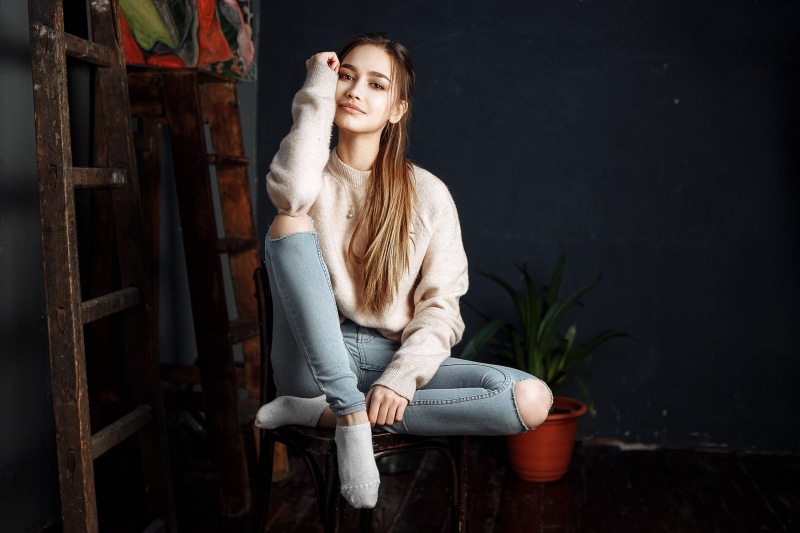 sweatshirt, socks, smiling, young adult, neck, one person, sitting, brown hair, hair, s, contemplation, Anastasia Lis, long hair, women, necklace, adult