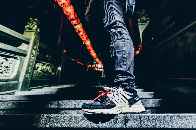 presto, pair, leisure activity, city, one person, lifestyles, casual clothing, railing, ladder, x, steps and staircases, jeans, human leg, bridge - man made structure