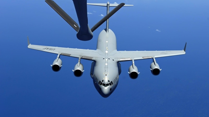 clear sky, transportation, blue, mid-air refueling, flying, army, aerospace industry, outdoors, mode of transportation, airplane, motion, nature, commercial airplane