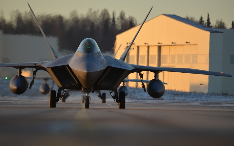 yellow, mode of transportation, day, built structure, sunset, outdoors, US Air Force, selective focus, transportation, black, aircraft, airplane, plane