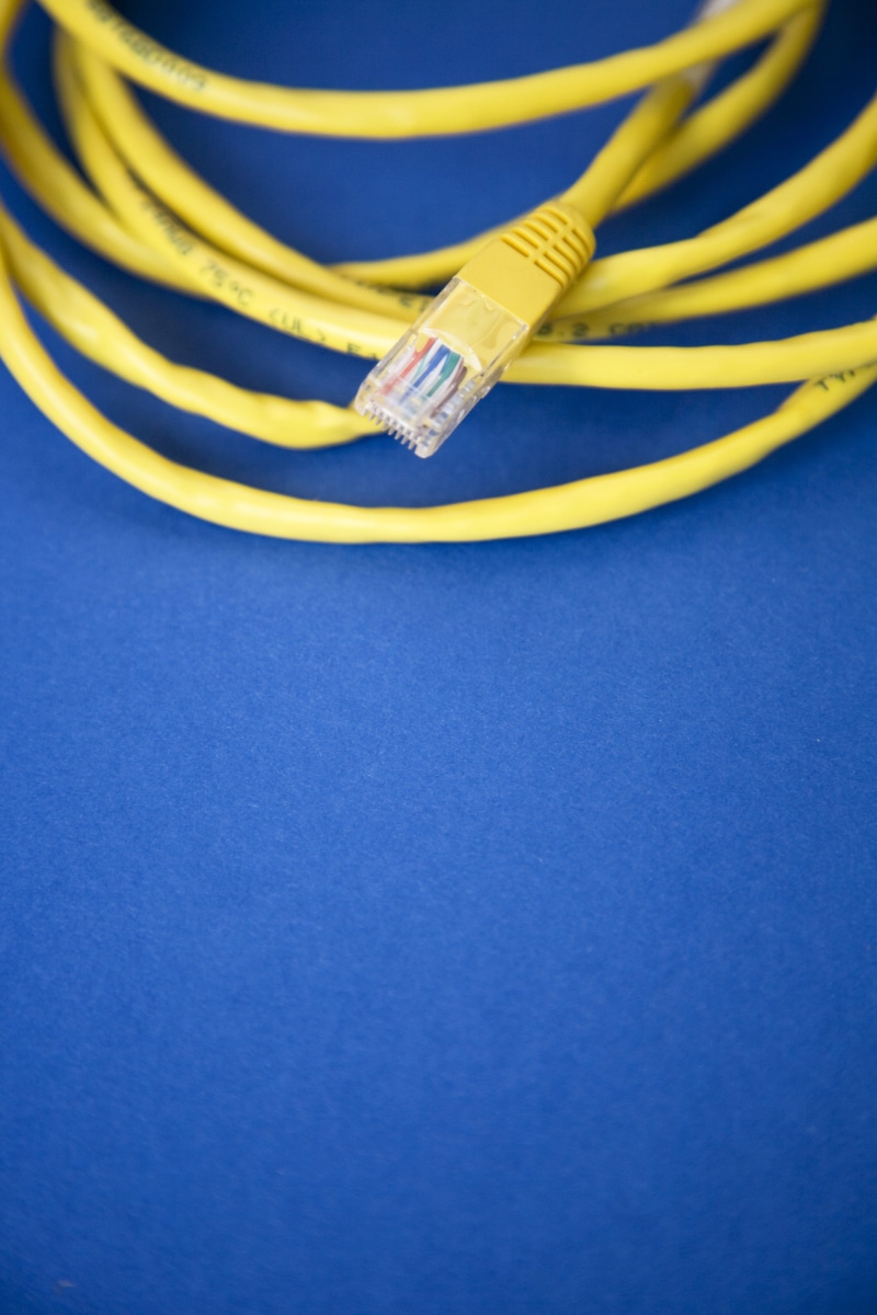colored background, phone cord, wired, yellow, wireless technology, indoors, ethernet, computer network, internet, connection, communication, surface, tech