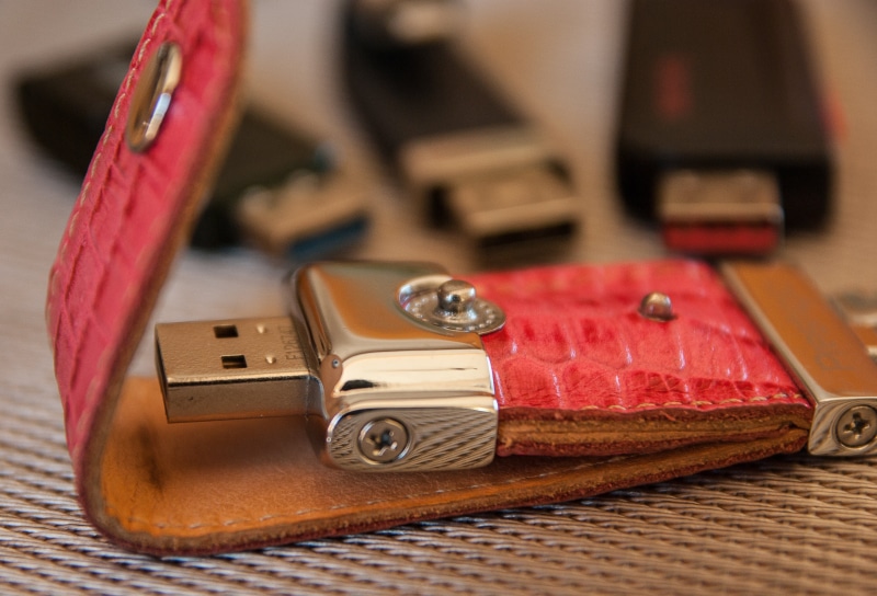 variation, table, close-up, focus on foreground, usb, leather, selective focus, wood - material, drive, digital, studio shot, computer, usb key, still life