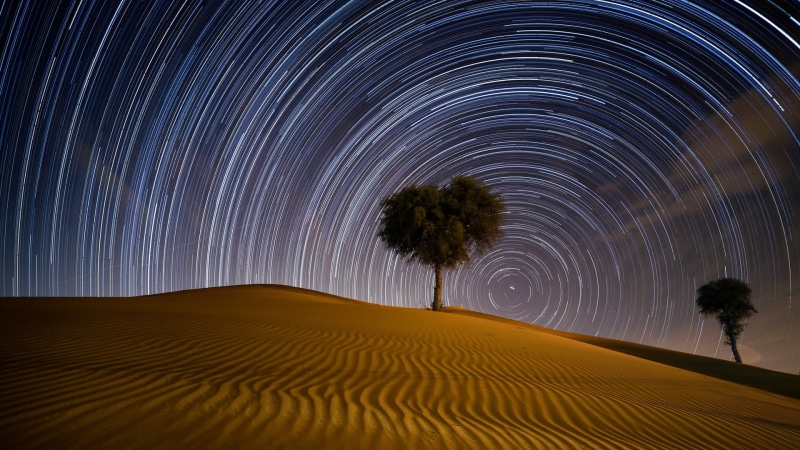 desert, motion, long exposure, beauty in nature, concentric, star trail, night, sand, space, environment, Dubai, star - space, no people, landscape, star trails
