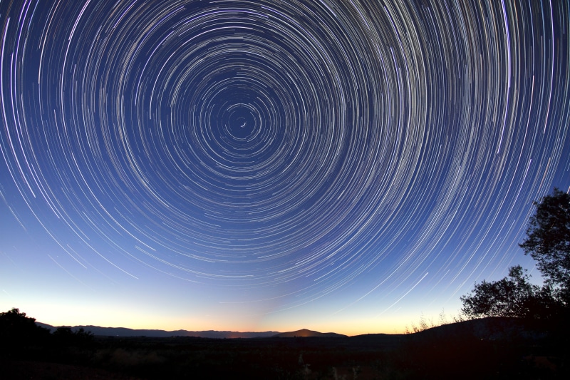 universe, star trail, sparkle, silhouette, sciene, tree, outdoors, nature, cosmos, trails, spinning, motion, rotation, physics, astronomy, starry, cosmic