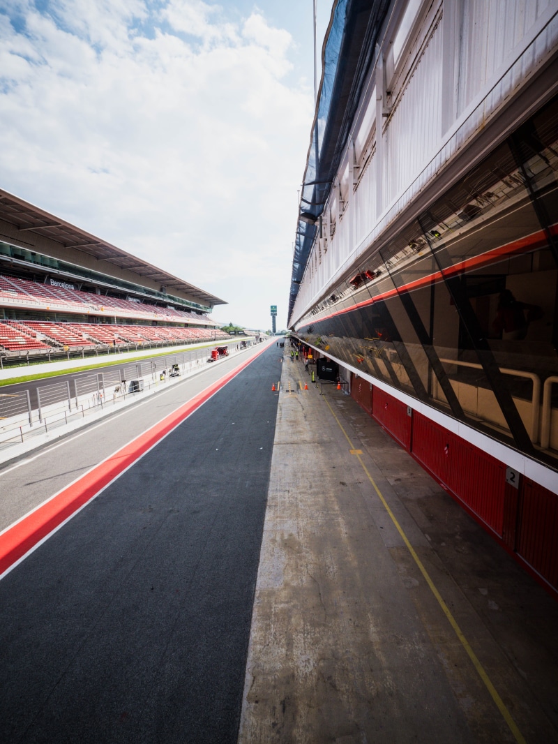 building exterior, direction, city, cloud - sky, racetrack, symbol, barcelona, formula one, archiltec, formule1, no people, car, gray, empty, race, nature