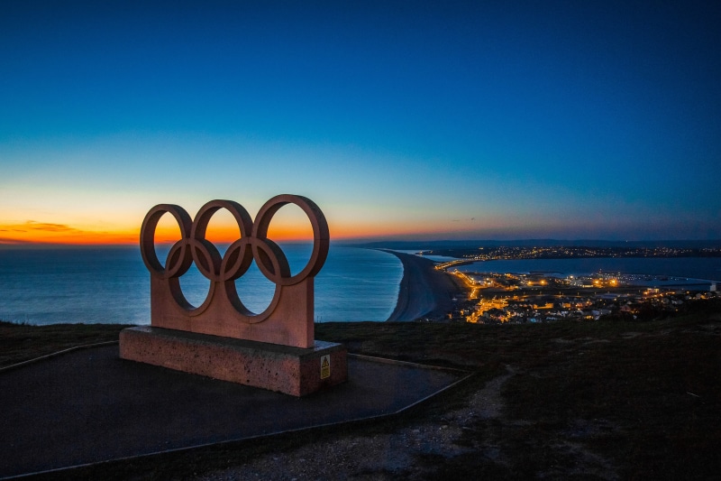 tranquility, scenics - nature, horizon, night, symbol, olympic rings, nature, beauty in nature, sunset, concrete, sea, blue, tranquil scene, olympic, no people