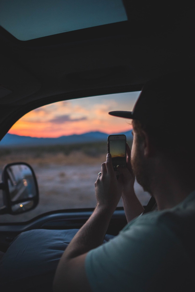 photography themes, holding, road, mirror, using phone, inside, lifestyles, motor vehicle, 1080P, man, smart phone, driver, taking, smartphone, communication