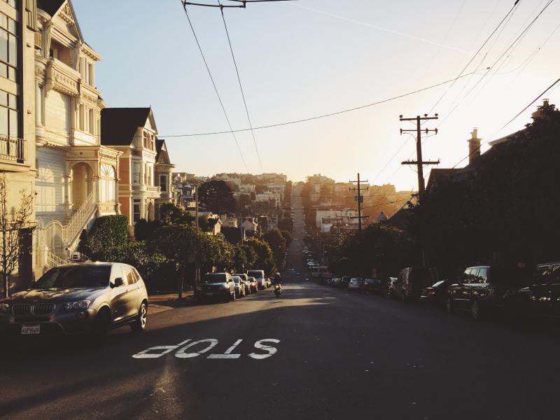district, motor vehicle, cable, outdoors, downtown, tourist, building, city, sign, cityscape, hill, san francisco, landmark, road, live, tower, power supply