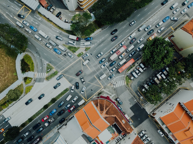 tree, transportation, city street, buildings, building, outdoors, 4K, built structure, crossroad, motor vehicle, road marking, urban, incidental people
