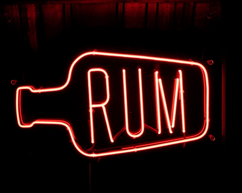 animal, illuminated, bar, dark, apparel, bright, light, usa, new york, communication, signage, red, bottle, candle, coat, arrow symbol, transportation