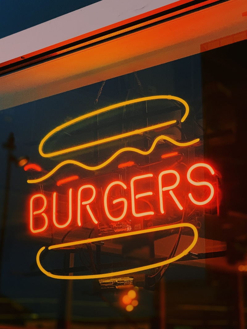 sign, building exterior, red, fur, city, meal, food, restaurant, communication, architecture, 2K, hardhat, hood, text, pasta, window, deli, advertisement