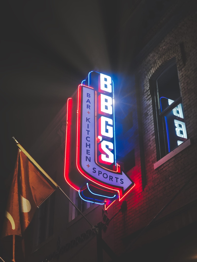 food, hood, diner, built structure, building, light, commercial sign, information sign, lighting equipment, trademark, headlight, logo, night, outdoors