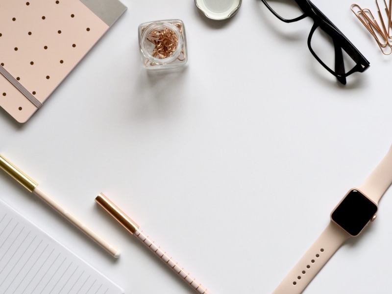 paper, white background, office supplies, indoors, still life, sport, business, eyewear, band, notebook, group of objects, apple, no people, directly above
