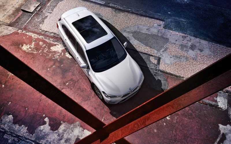 close-up, BMW X1, outdoors, damaged, telecommunications equipment, black, black color, mobile phone, communication, day, car, technology, smart phone, die