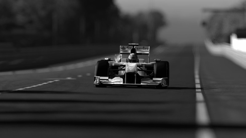 selective focus, bottle, sports, race cars, race tracks, road, nature, outdoors, sports car, sitting, footpath, monochrome, men, one person, Formula 1