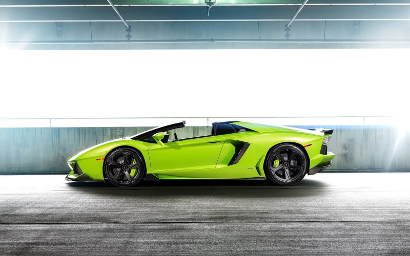 automobile industry, industry, land vehicle, business, architecture, mode of transportation, yellow, luxury cars, indoors, no people, wheel, modern, model