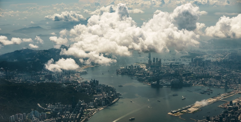 water, building, skyscraper, building exterior, day, 5K, sea, high angle view, nature, air pollution, outdoors, sky, city, built structure, aerial view