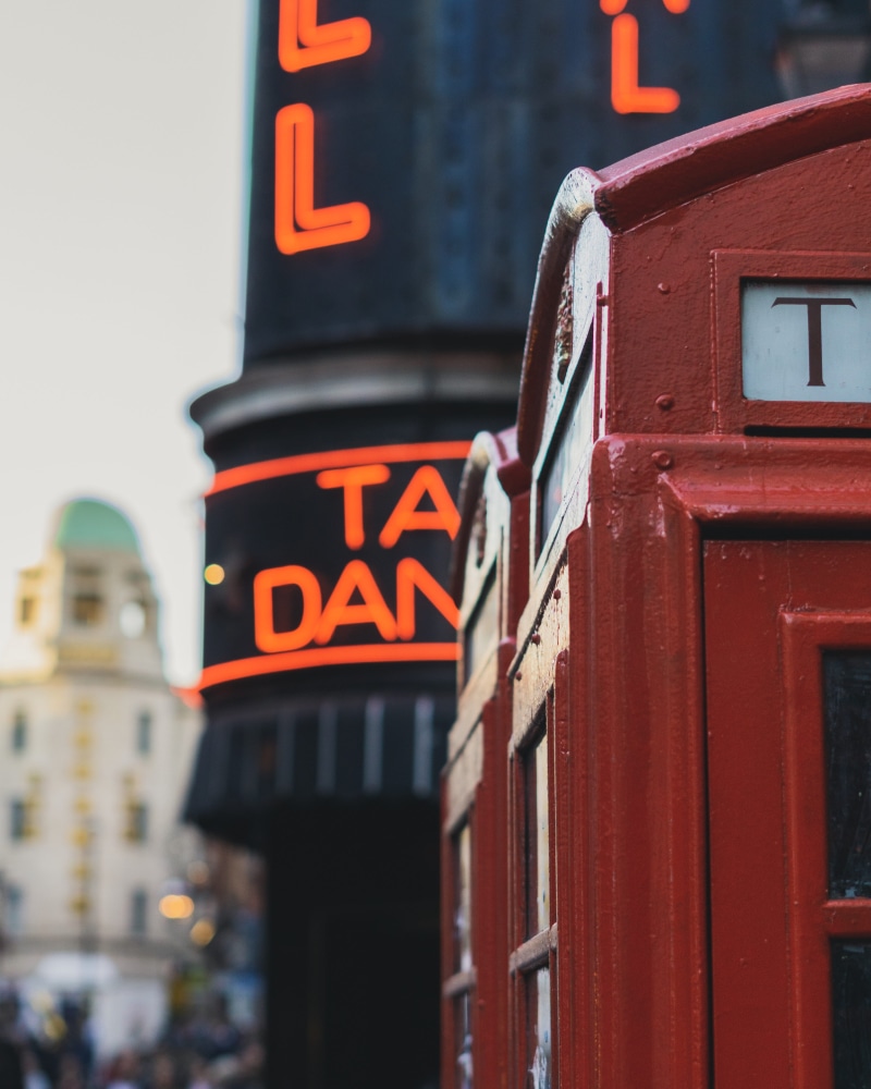 communication, street, tram, low angle view, western script, sign, number, kiosk, moody, london telephone, phone booth, close-up, text, train, telephone