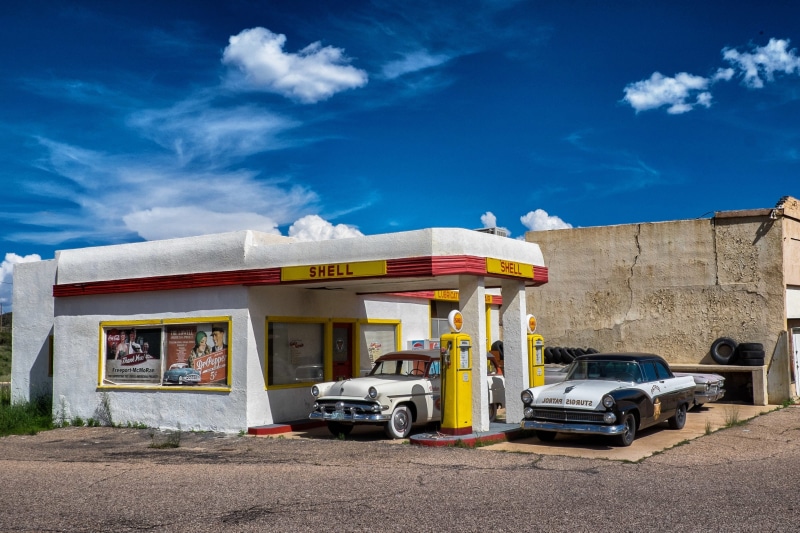 no people, day, nature, vintage, old, station, architecture, auto, blue, commercial land vehicle, sunlight, sky, 1950s, outdoors, refuel, cloud - sky, filling