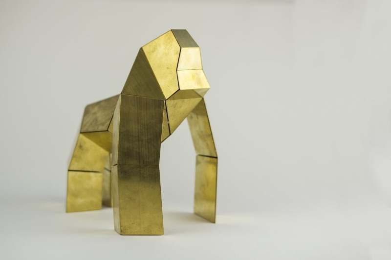 yellow, studio shot, gorilla, ingot, sculpture, no people, geometric, close-up, table, still life, gray background, pattern, figurine, art and craft, metal