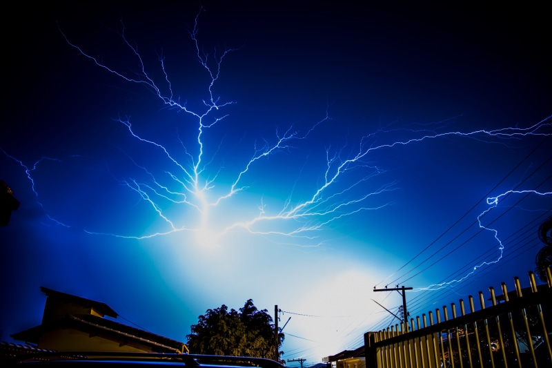 electricity, rain, electric, outdoors, strike, cloud - sky, trees, meteorology, flash, purple, lightning, luminescence, dark, low angle view, landscape
