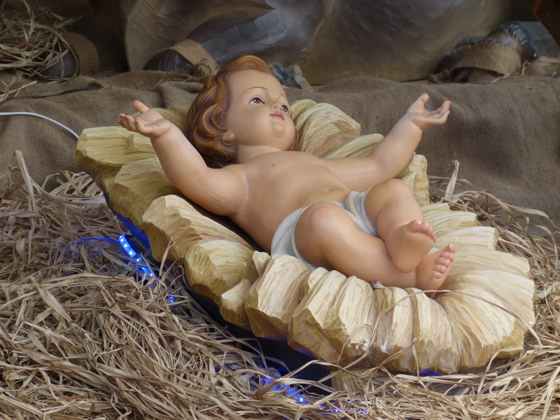 nativity scene, beauty, christmas, lying down, real people, lifestyles, plant, figurine, innocence, baby, one person, day, straw, leisure activity, hairstyle