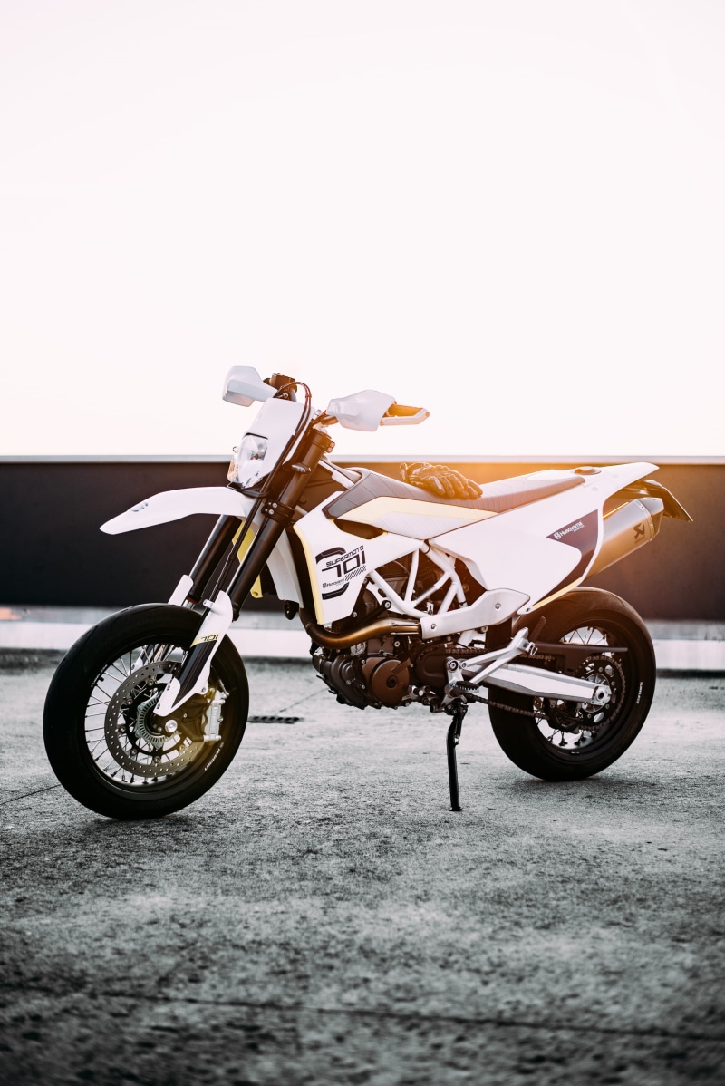 road, sky, motorcycle, city, nature, crash helmet, concrete, outdoors, mode of transportation, land vehicle, bicycle, one person, sport, black, sports equipment