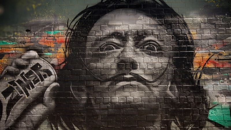 outdoors, human representation, creativity, selective coloring, painting, street art, Salvador Dalí, built structure, woman, moustache, art and craft, architecture
